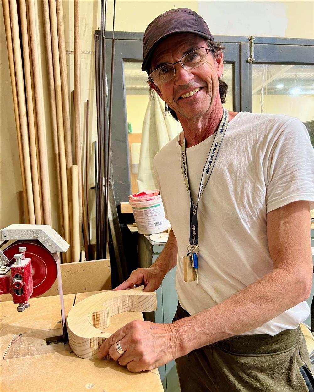 Jobseeker Adrian making wooden toys